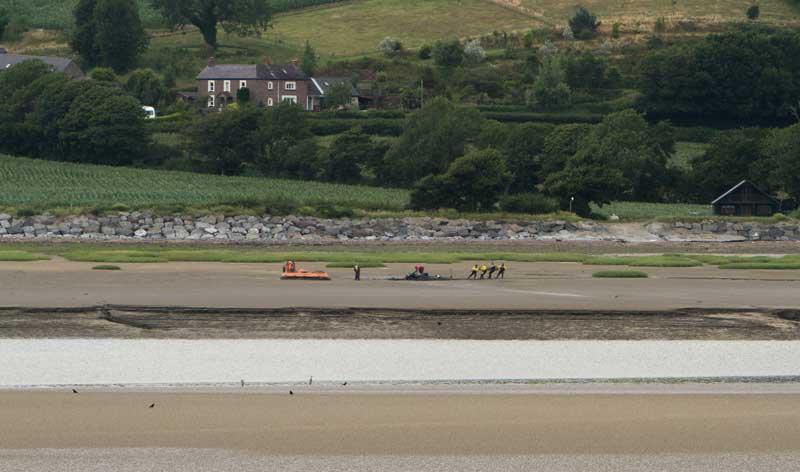 Ferryside Lifeboat pulling a quad bike from the mud